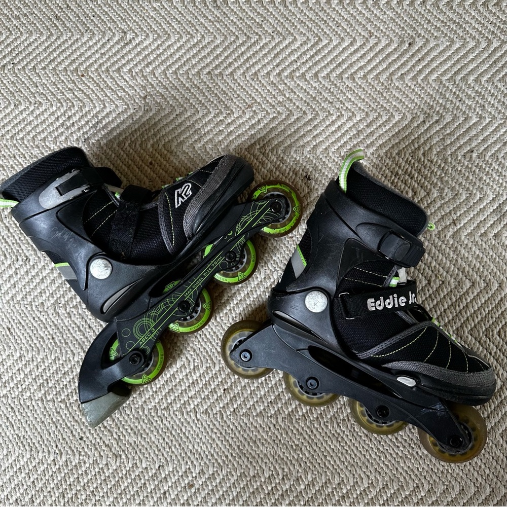 K2 Black Inline Skates, youth adjustable sizing 1-5, knee and wrist guards.